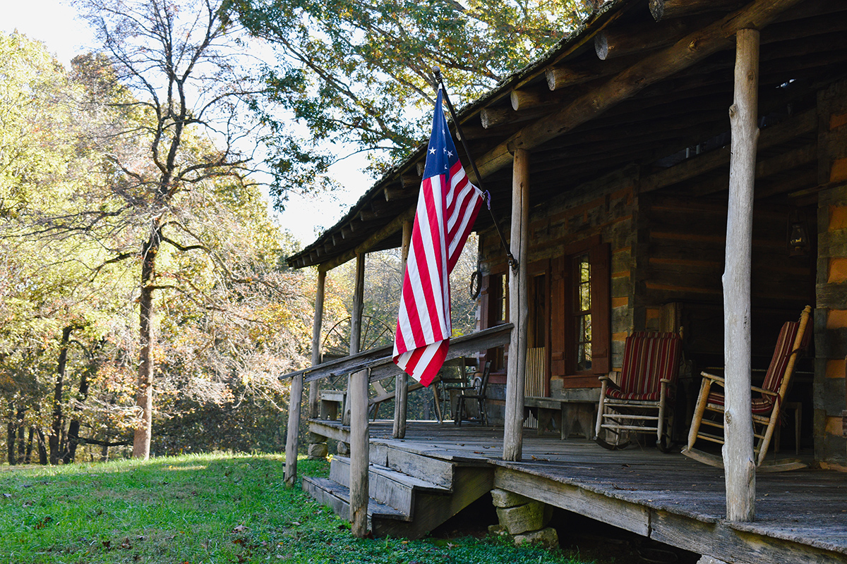 flag on a historic log home